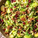 Shaved Brussels Sprout Salad with Pomegranate and Candied Pecans
